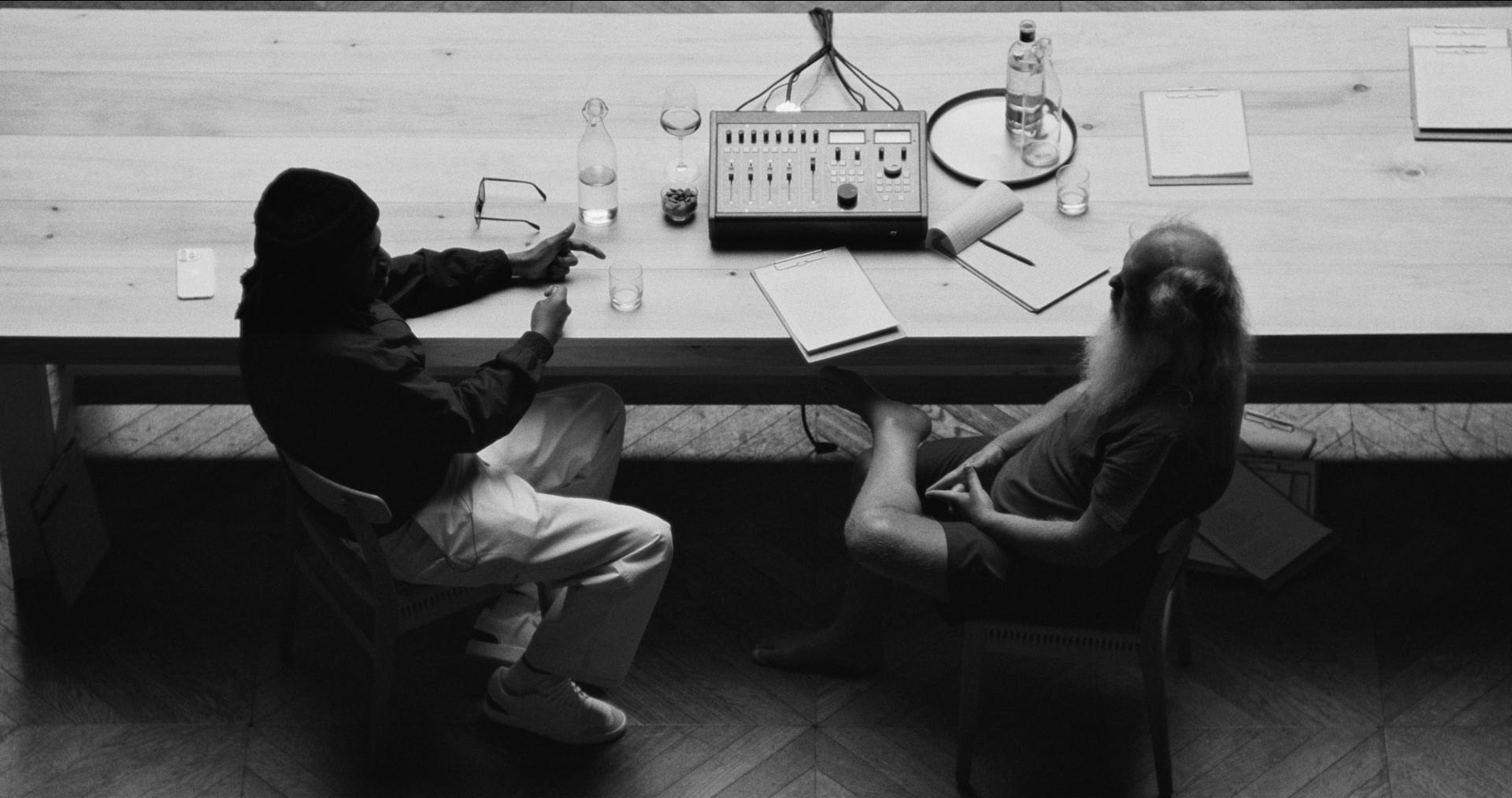 Jay-Z and Rick Rubin seated across from one another during JAŸ-Z In 8